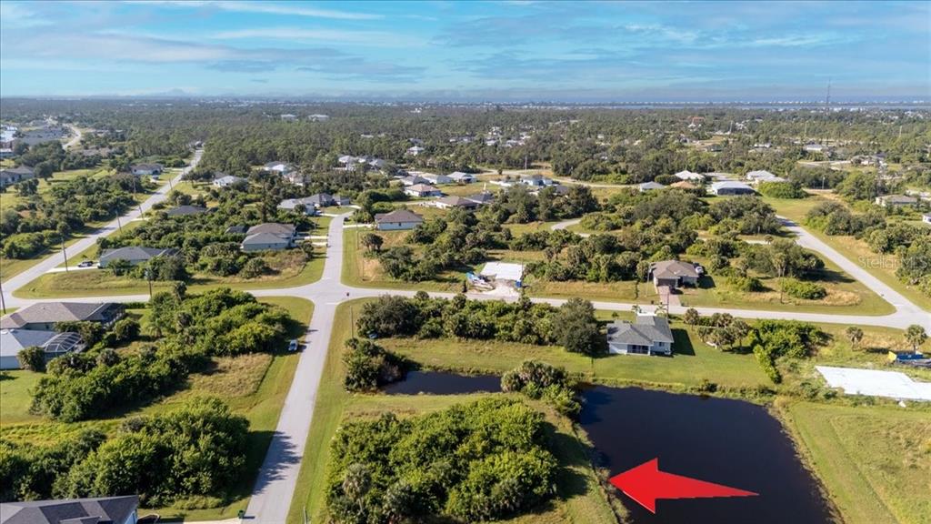 153 Spring Drive Rotonda West, FL 33947 - Photo 10 of 13 an aerial view of residential houses with outdoor space