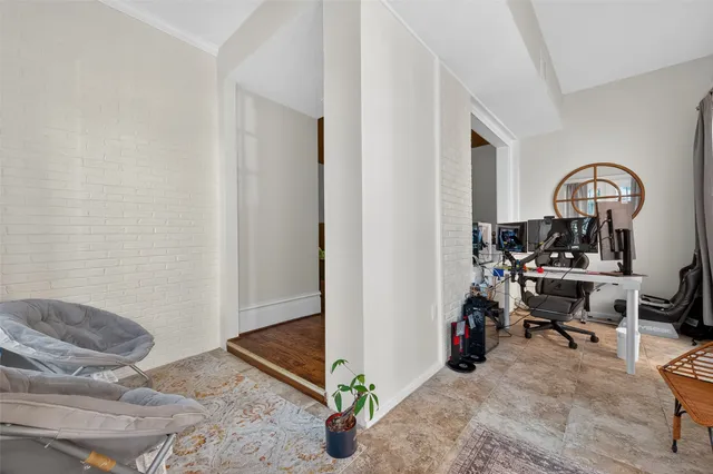 a view of a workspace with furniture