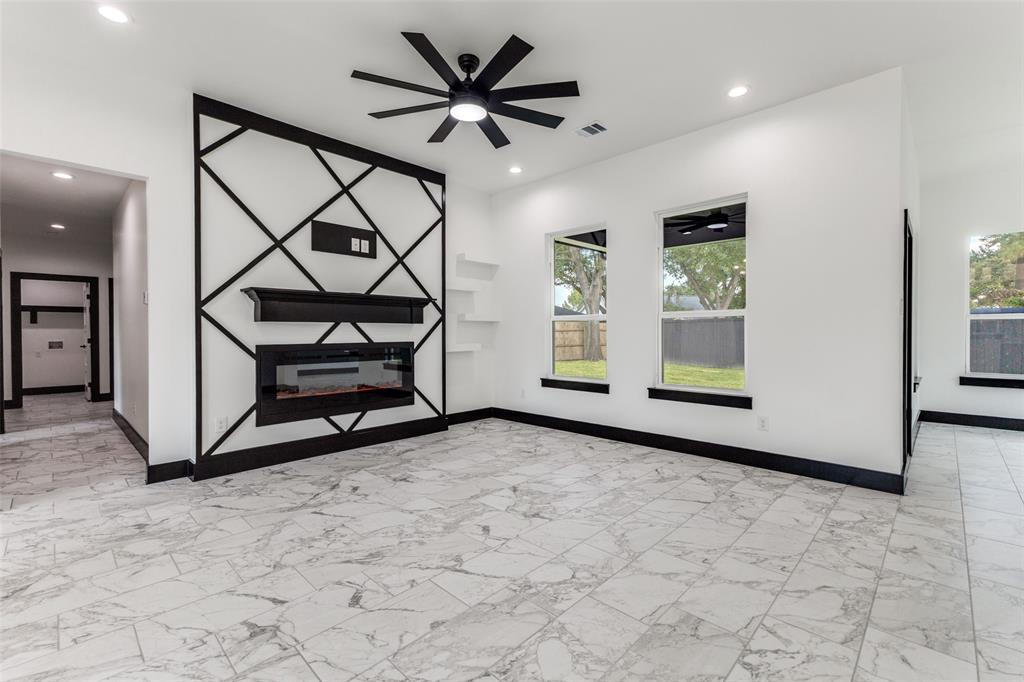 18508 Hickory Circle Kemp, TX 75143 - Photo 12 of 27 an empty room with windows and ceiling fan