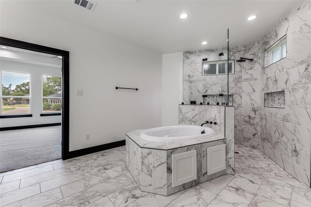 18508 Hickory Circle Kemp, TX 75143 - Photo 17 of 27 a spacious bathroom with a sink a toilet and shower