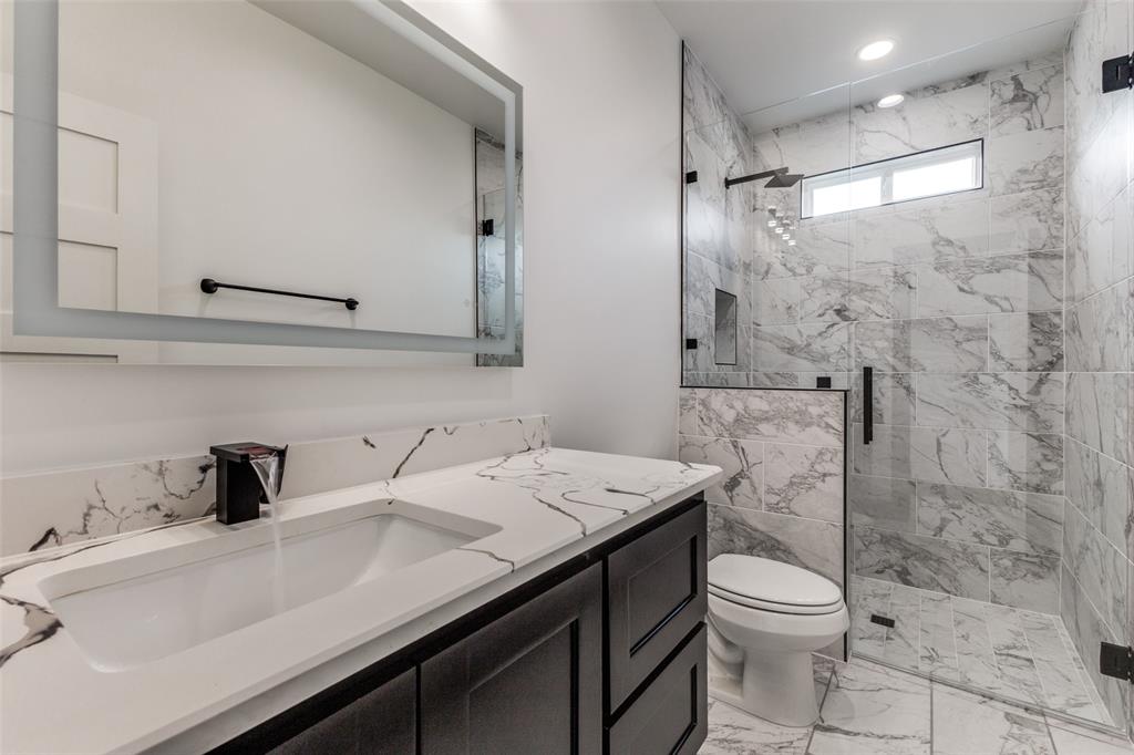 18508 Hickory Circle Kemp, TX 75143 - Photo 24 of 27 a bathroom with a sink a toilet and shower