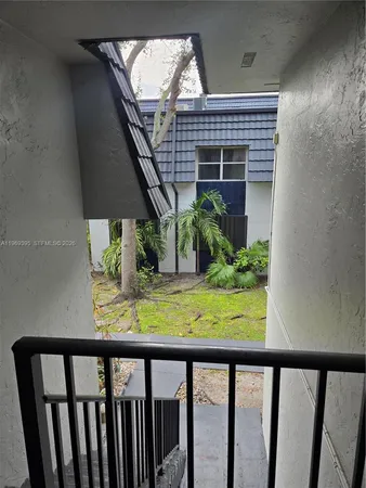 a view of balcony with wooden floor