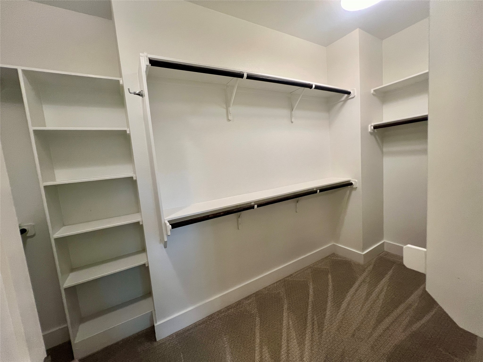 6515 Davis Lane, Unit 10 Austin, TX 78749 - Photo 15 of 22 Ample shelving and hanging space defines this well-organized walk-in closet.