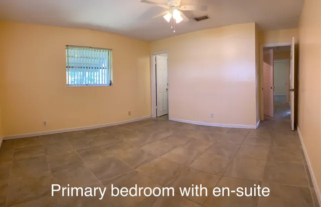 a bathroom with a toilet sink and a mirror