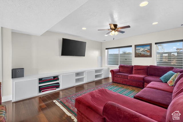 4768 East Hickman Canyon Road Stockton, UT 84071 - Photo 39 of 85 Basement living room featuring a ceiling fan, wood-style flooring and recessed lighting.
