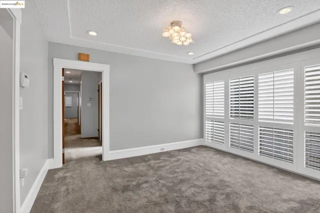 wooden floor in an empty room and a window