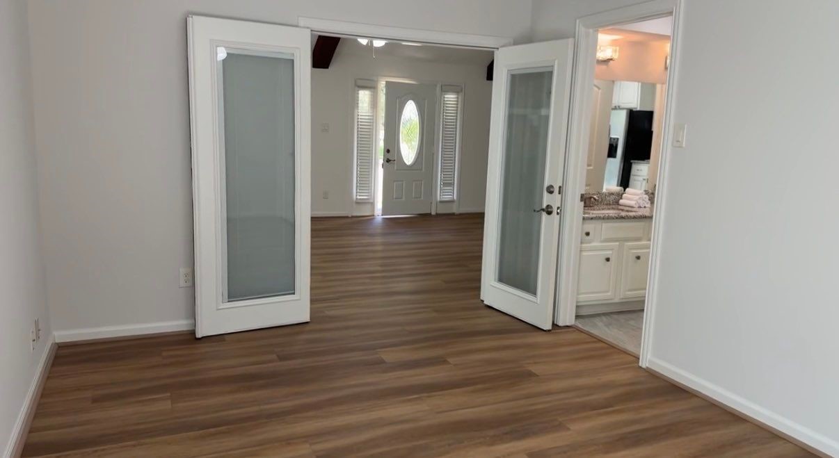 9626 Magnolia Ridge Drive Houston, TX 77070 - Photo 18 of 40 a view of a hallway with wooden floor