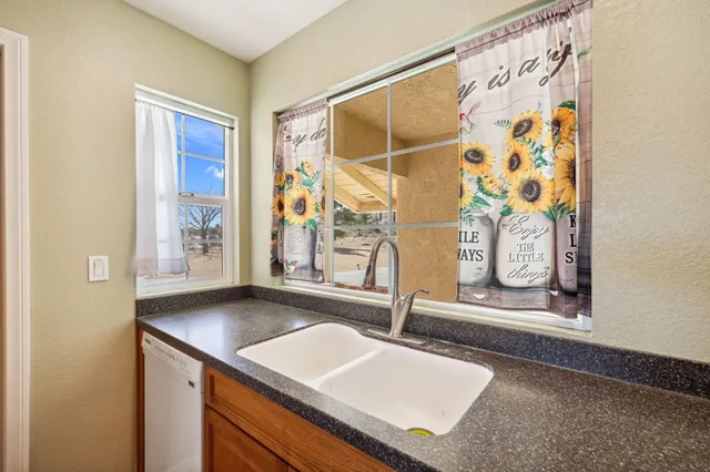 a bedroom with a bed and a chair