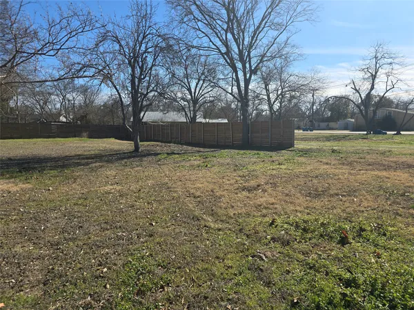 a backyard of a house with trees