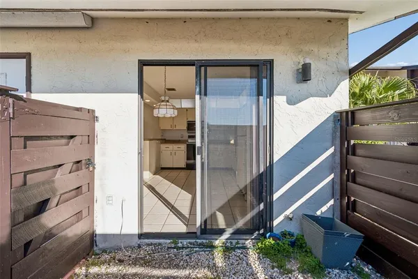 a spacious bathroom with a granite countertop sink a toilet mirror and a bathtub