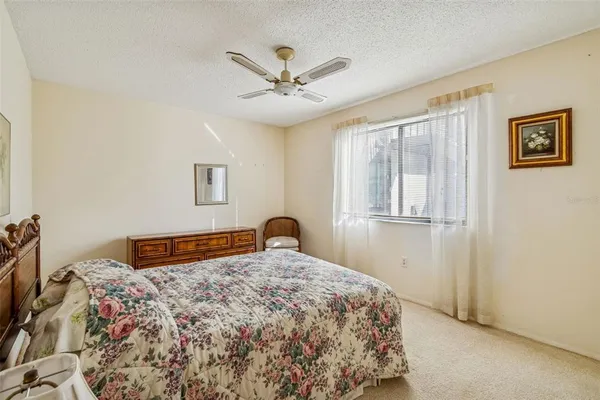 a living room with a floor to ceiling window and floor to ceiling window