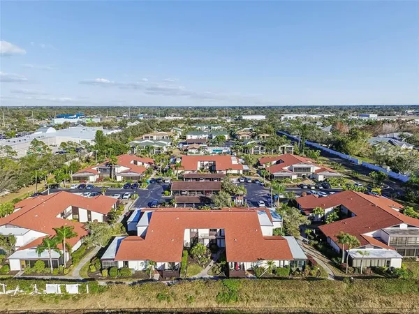 a view of a park with large trees