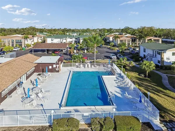 a view of a swimming pool with a patio