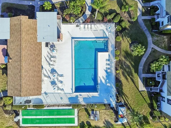 a view of swimming pool with outdoor seating