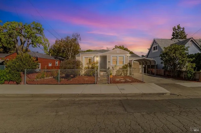 a front view of a house with yard