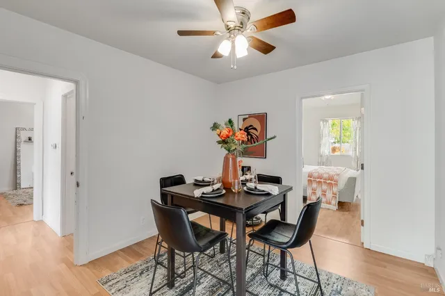 a bedroom with furniture and wooden floor