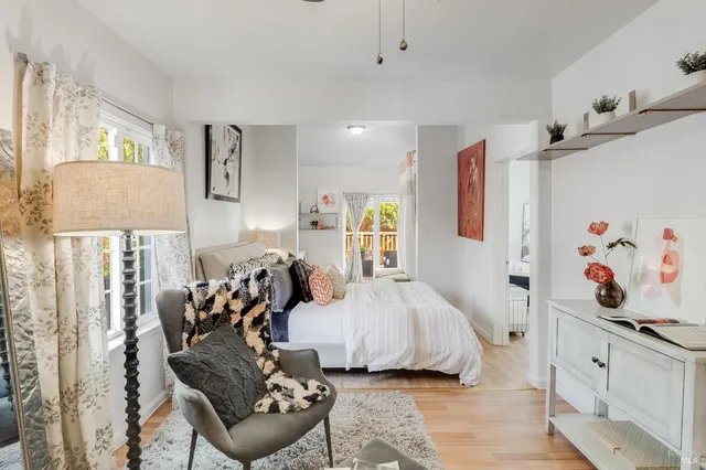 a storage room with wooden cabinets washer and dryer
