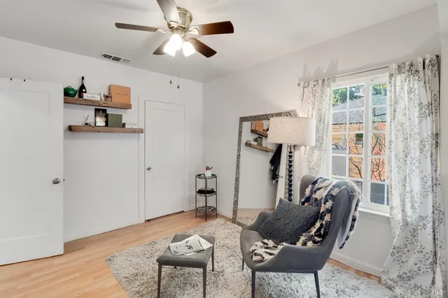 a bathroom with a sink mirror and toilet