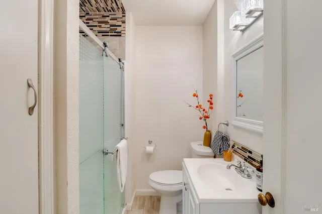 a bedroom with furniture and a book shelf