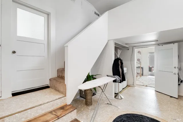 a view of a bench in the backyard