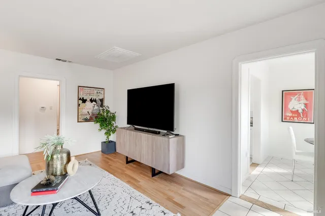 a kitchen with stainless steel appliances a sink stove and refrigerator