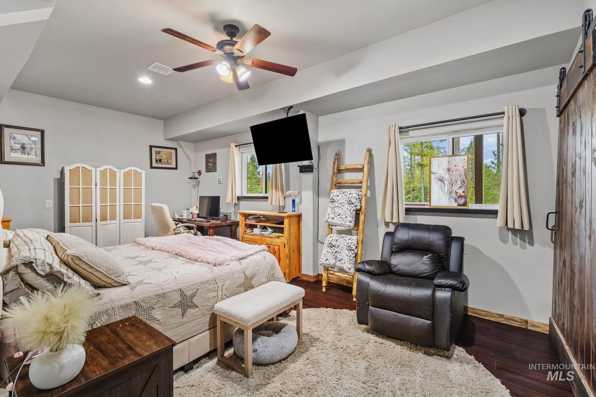 3989 East Mountain Road Anatone, WA 99401 - Photo 49 of 49 Recessed lighting, wood-finish flooring, and a ceiling fan with integrated lighting