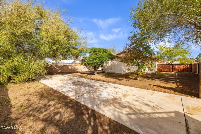 a view of yard and mountain