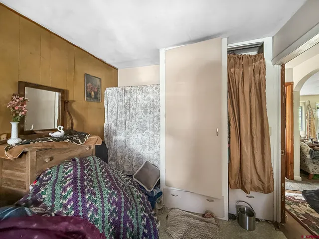 a view of a bedroom with workspace