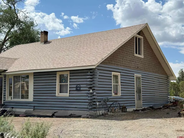 a house view with a backyard space