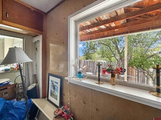 a room with furniture and a large window