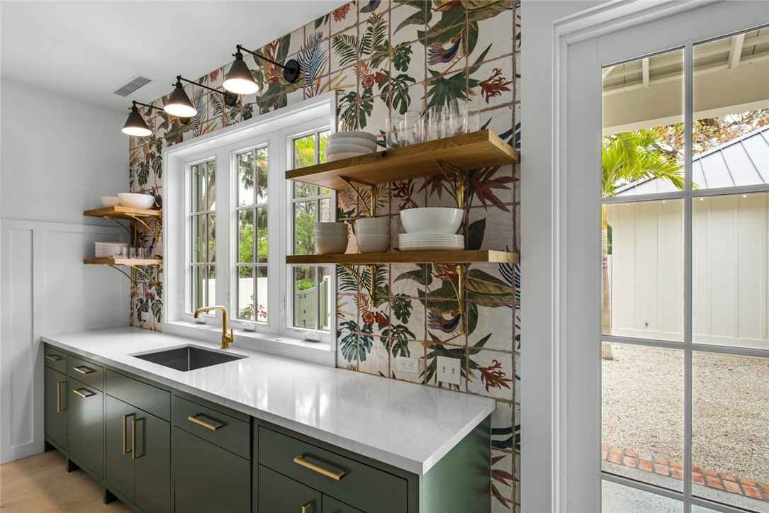 855 Sandfly Lane Vero Beach, FL 32963 - Photo 12 of 35 a view of a kitchen with a sink and a window