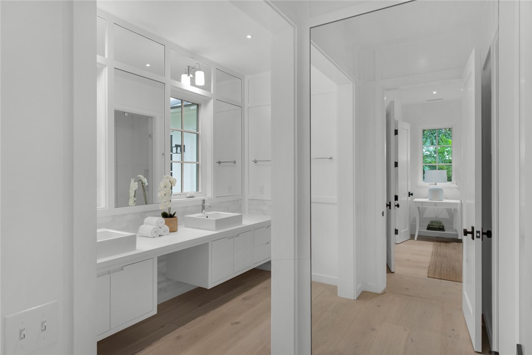 855 Sandfly Lane Vero Beach, FL 32963 - Photo 17 of 35 a bathroom with a double vanity sink mirror and shower