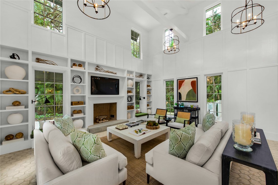 855 Sandfly Lane Vero Beach, FL 32963 - Photo 2 of 35 a living room with furniture and a fireplace