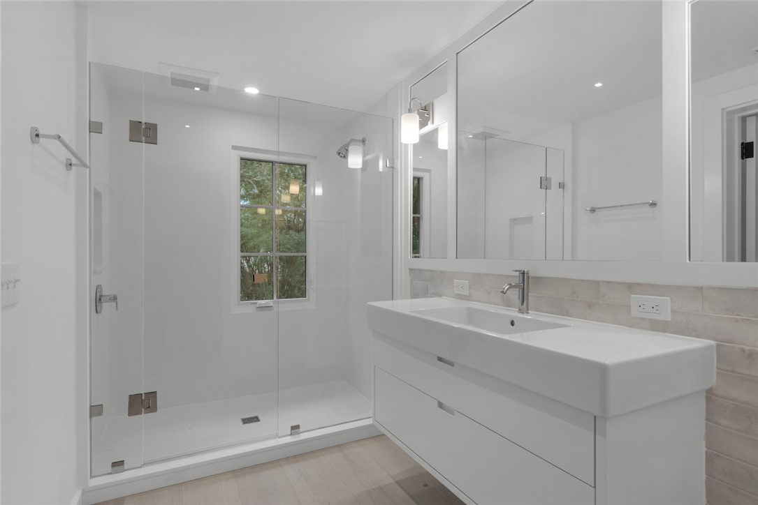 855 Sandfly Lane Vero Beach, FL 32963 - Photo 22 of 35 a bathroom with a shower sink and mirror