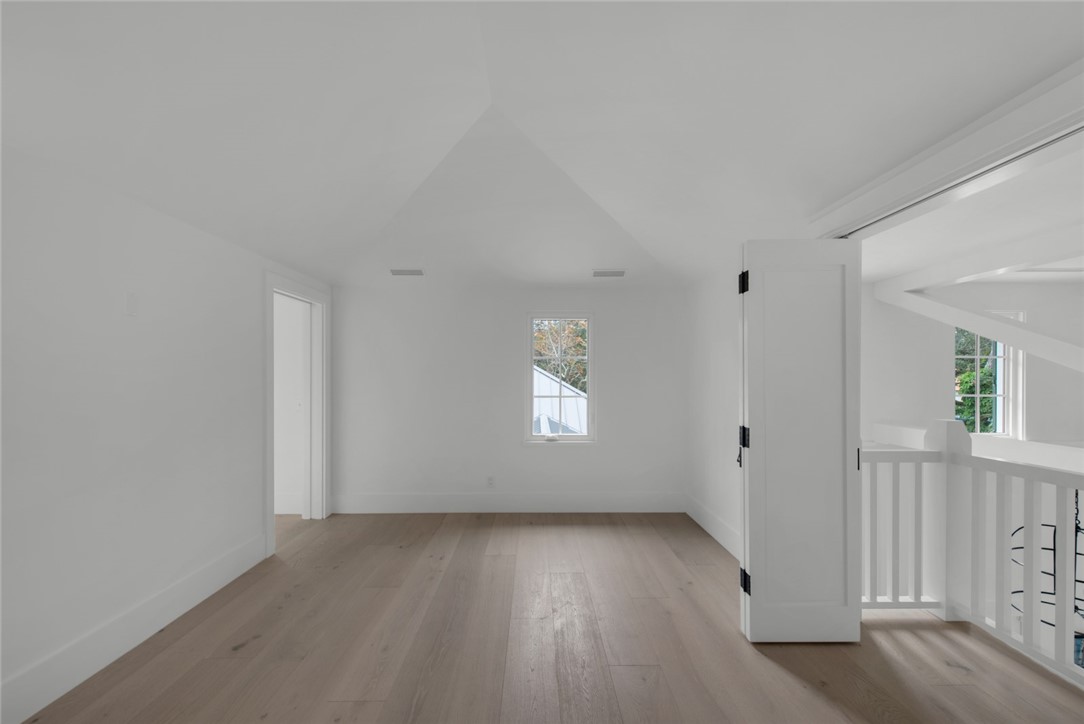 855 Sandfly Lane Vero Beach, FL 32963 - Photo 27 of 35 an empty room with wooden floor and windows