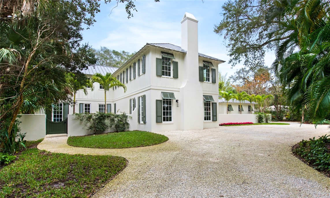 855 Sandfly Lane Vero Beach, FL 32963 - Photo 29 of 35 a front view of a house with a yard and garage