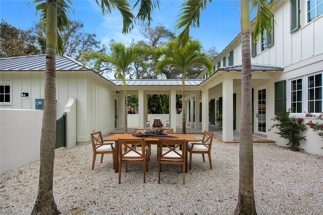 855 Sandfly Lane Vero Beach, FL 32963 - Photo 31 of 35 a view of a dinning table and chairs in patio of the house