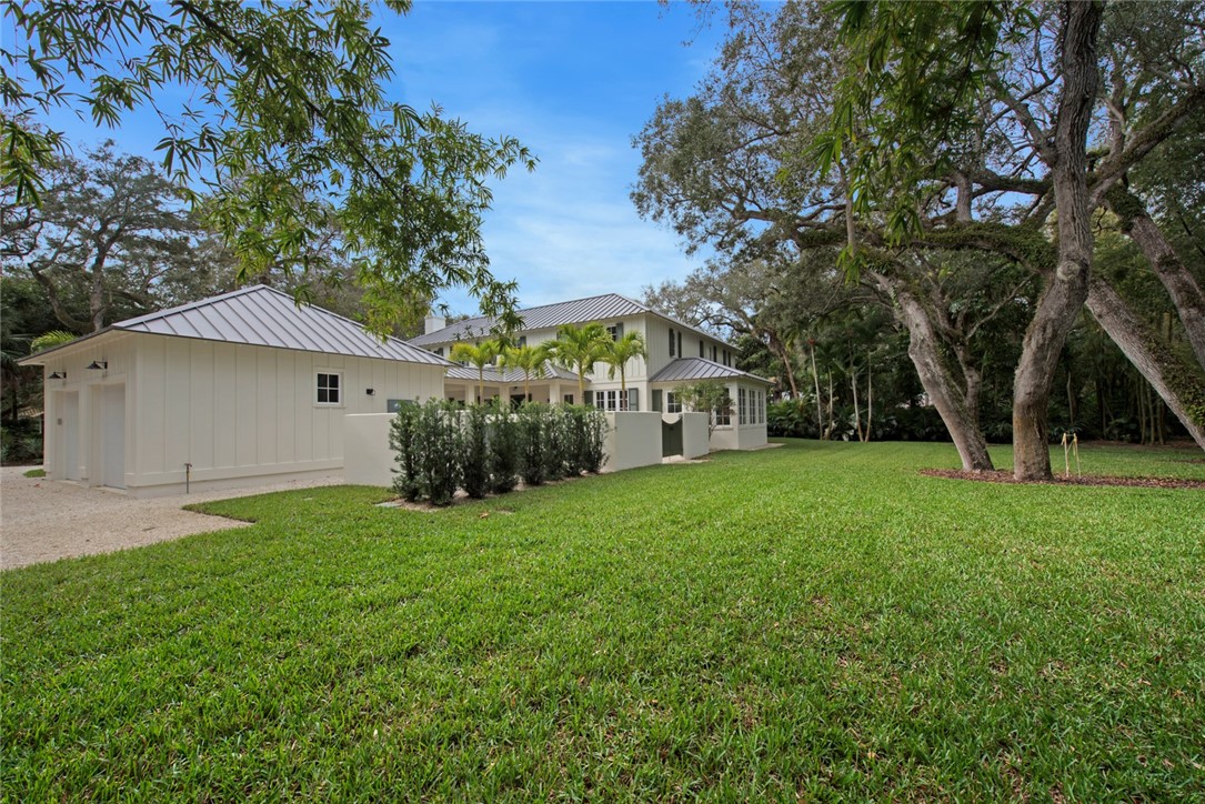 855 Sandfly Lane Vero Beach, FL 32963 - Photo 34 of 35 a view of a house with backyard and garden