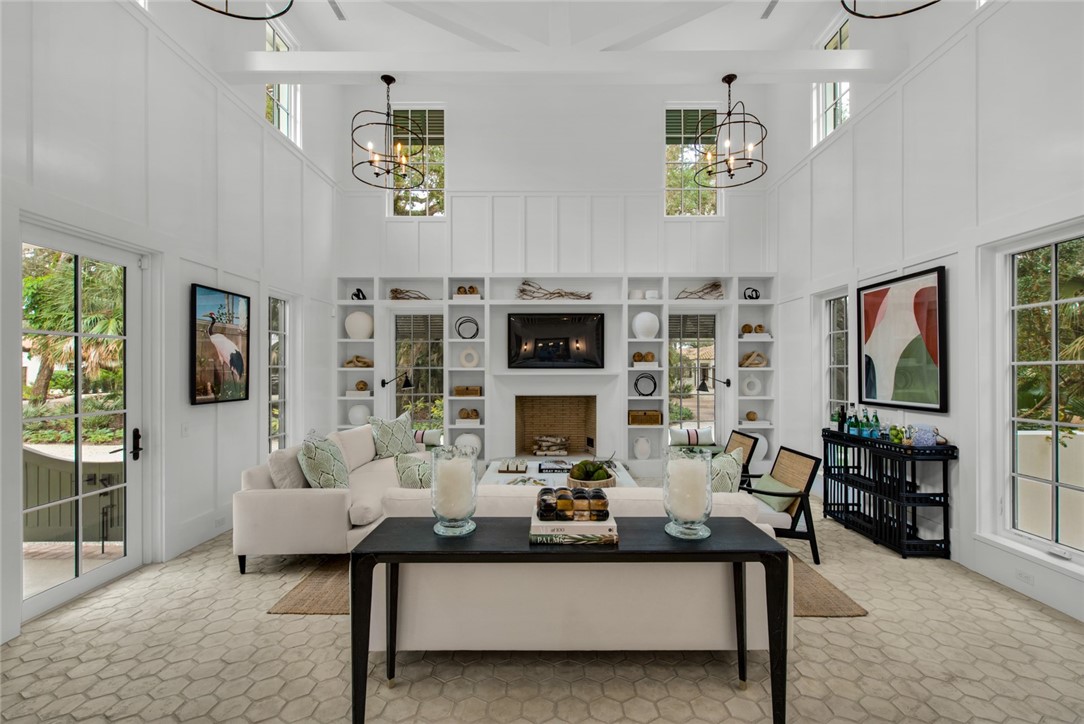 855 Sandfly Lane Vero Beach, FL 32963 - Photo 7 of 35 a living room with furniture a fireplace and a flat screen tv