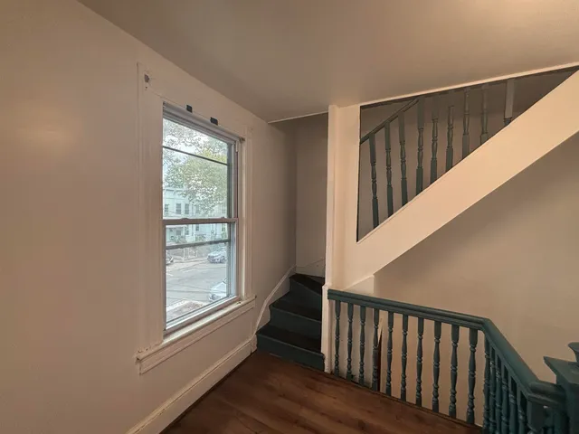 a view of entryway with wooden floor