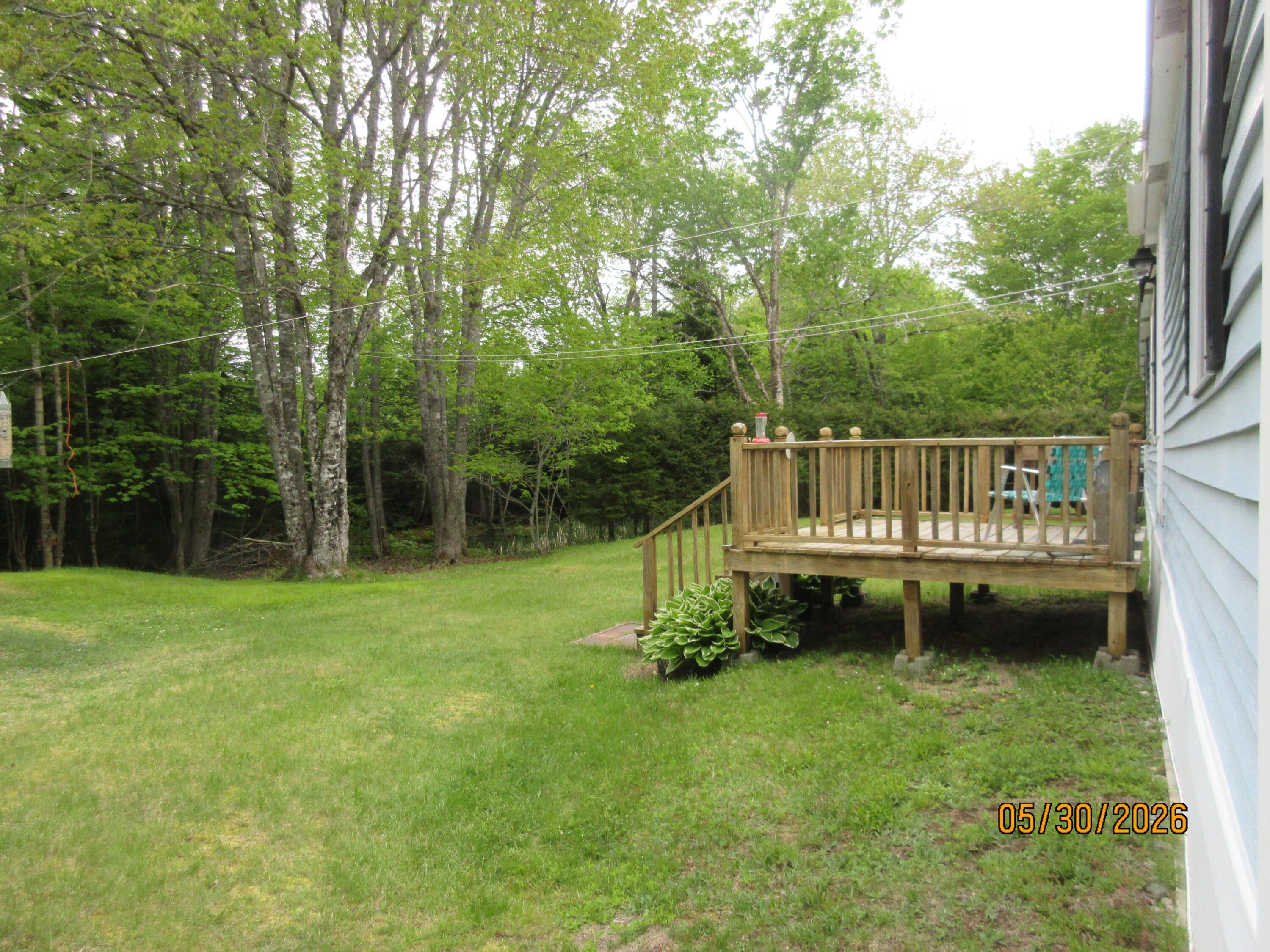 1228 Basin Road Addison, ME 04606 - Photo 4 of 18 Exterior side with deck and yard