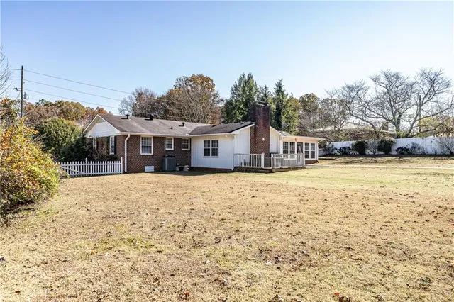 a house with trees in the background