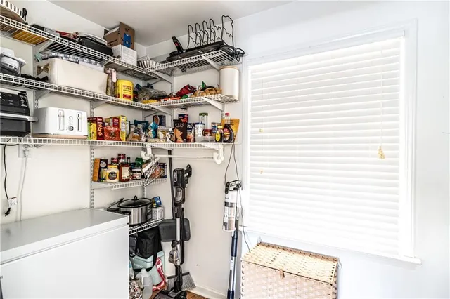a view of storage and utility room with washer and dryer