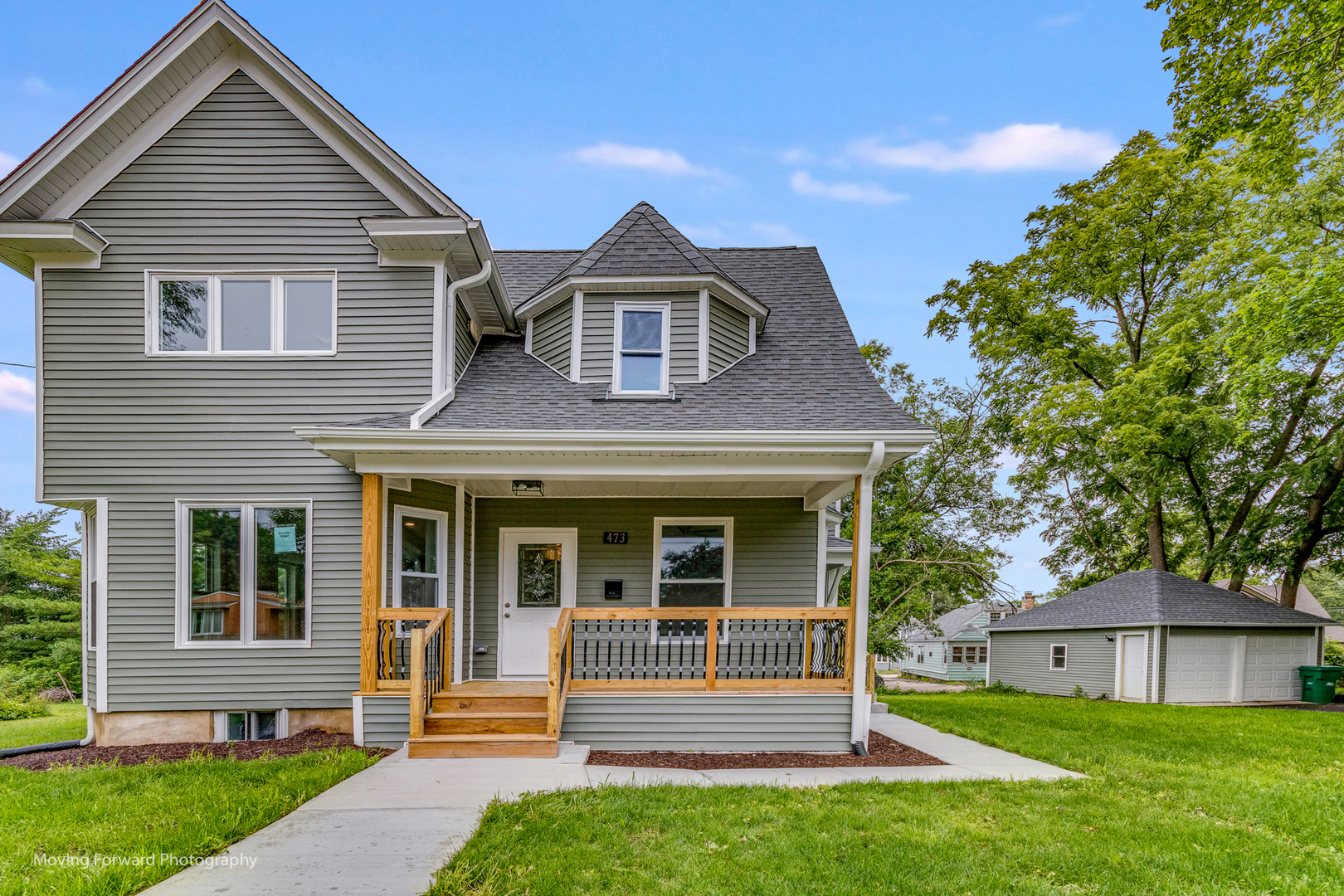 473 East Elm Street Sycamore, IL 60178 - Photo 2 of 53 a front view of a house with a yard