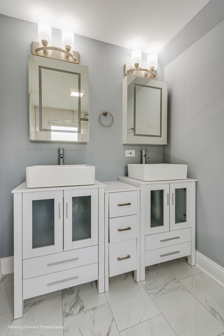 473 East Elm Street Sycamore, IL 60178 - Photo 27 of 53 a bathroom with a sink vanity and mirror