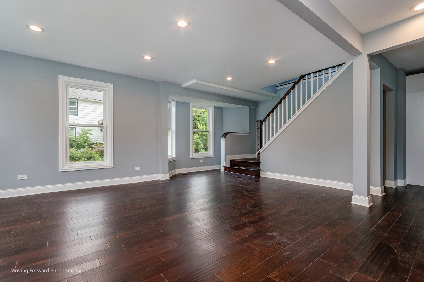 473 East Elm Street Sycamore, IL 60178 - Photo 33 of 53 an empty room with wooden floor staircase and windows