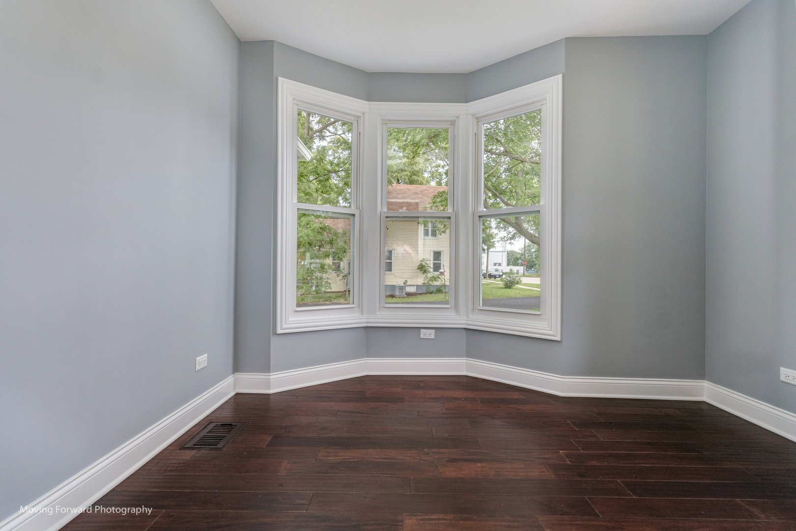 473 East Elm Street Sycamore, IL 60178 - Photo 40 of 53 a view of an empty room with wooden floor and a window