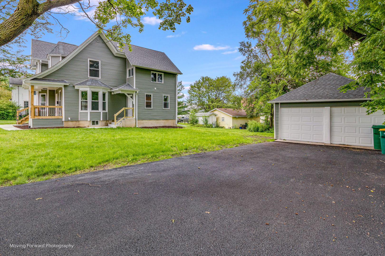 473 East Elm Street Sycamore, IL 60178 - Photo 5 of 53 a front view of a house with a garden and yard