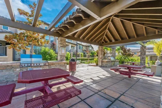 a view of yard from deck with patio