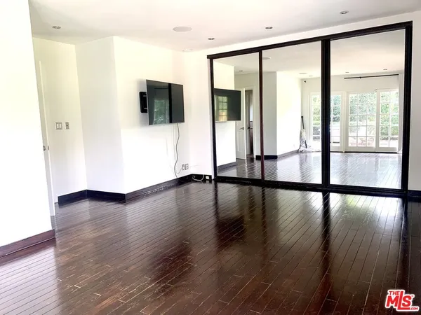 a view of a livingroom with wooden floor